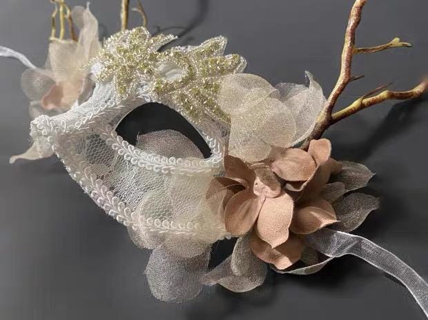 Artistic design details of the Ivory Romantic Floral Vertical Branch Details Masquerade Mask