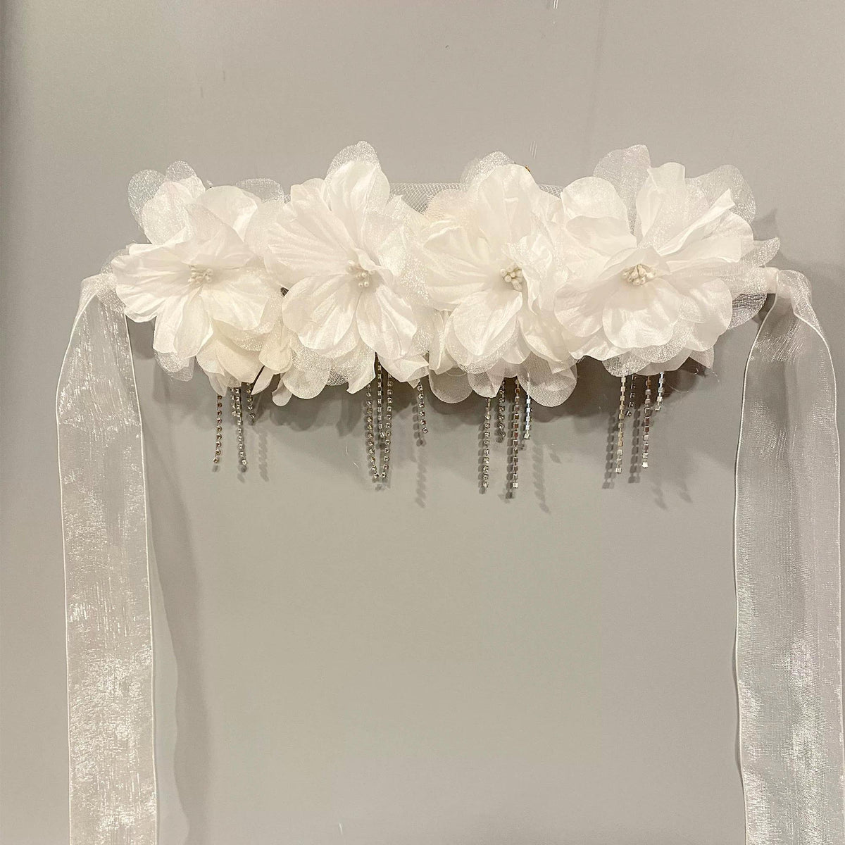 Detailed view of the handmade White Avant-Garde Floral Silk Blossoms Crystal Masquerade Mask