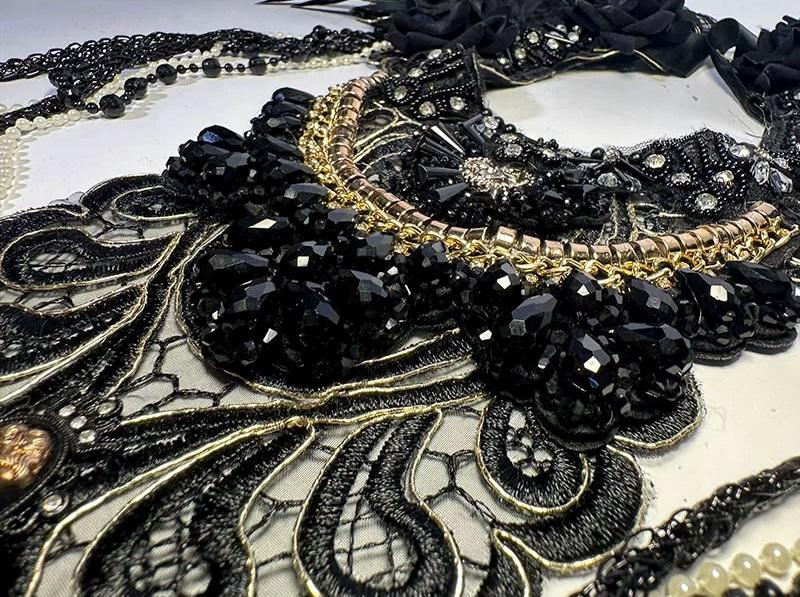 Black Gothic Feather Collar Lace Embroidery Baroque Cape displayed as wearable art