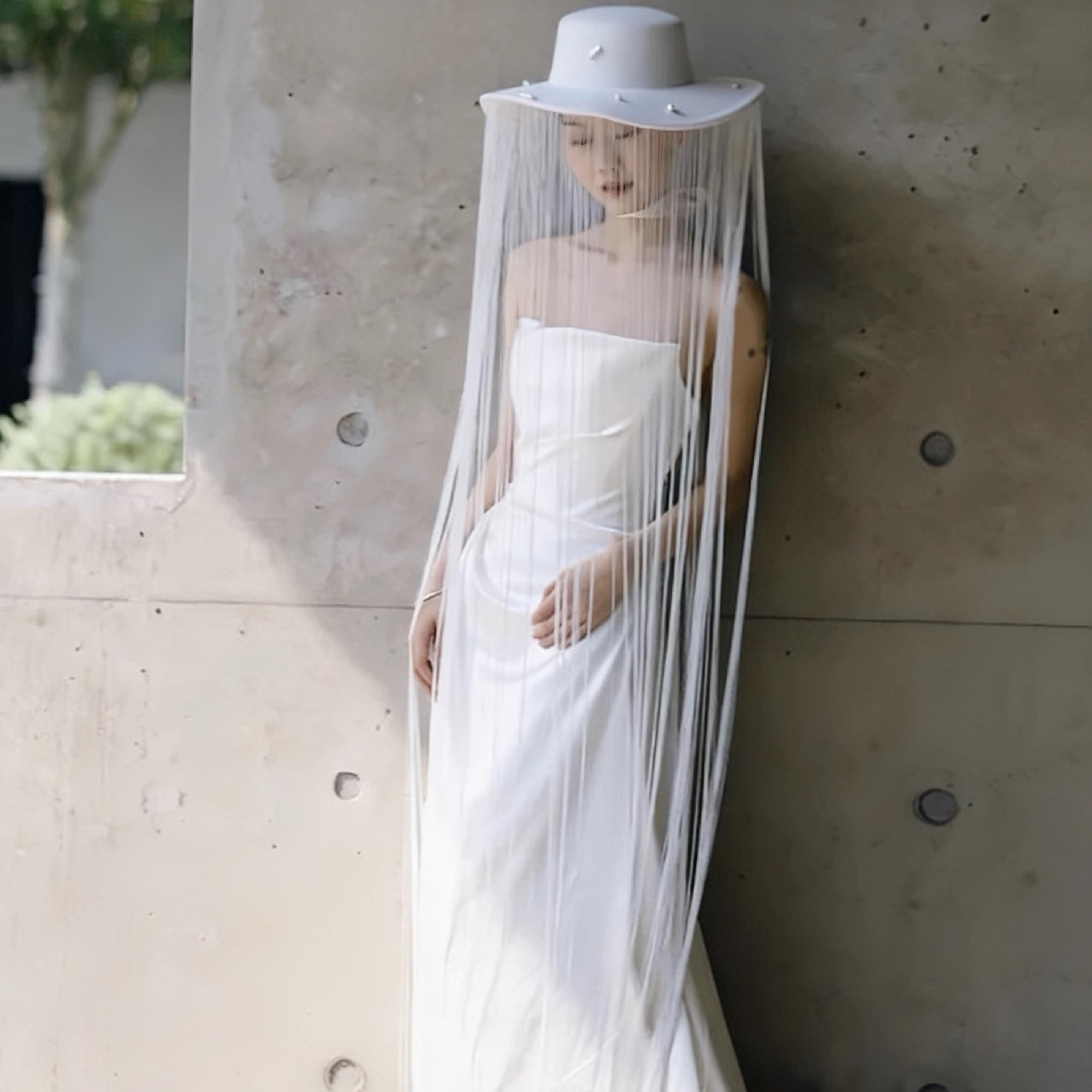 White Long Fringe Pearl Studs Hat displayed as wearable art