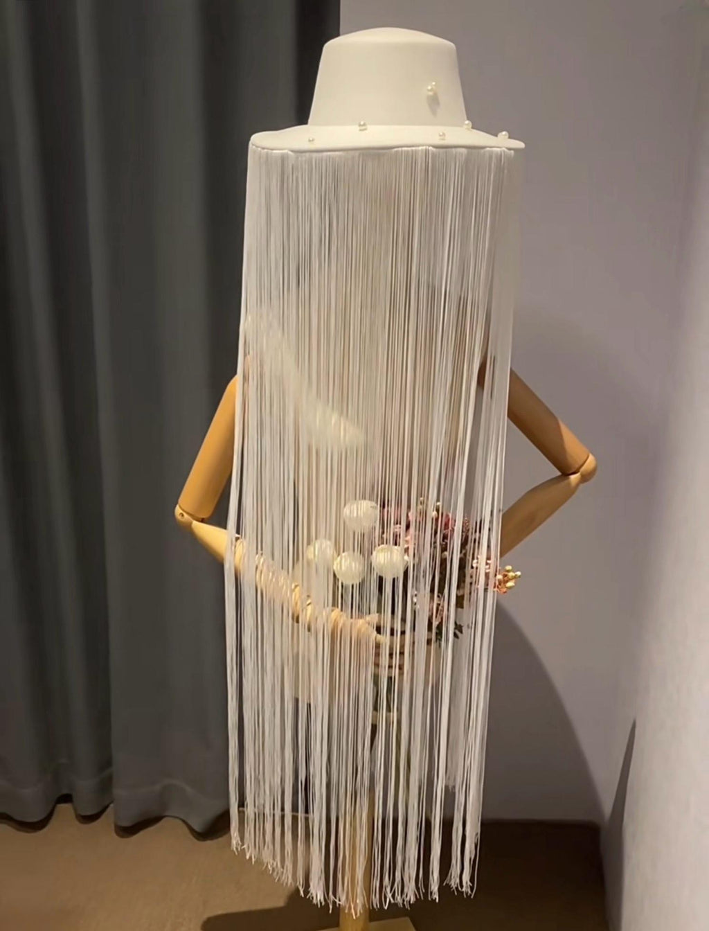 Detailed view of the handmade White Long Fringe Pearl Studs Hat