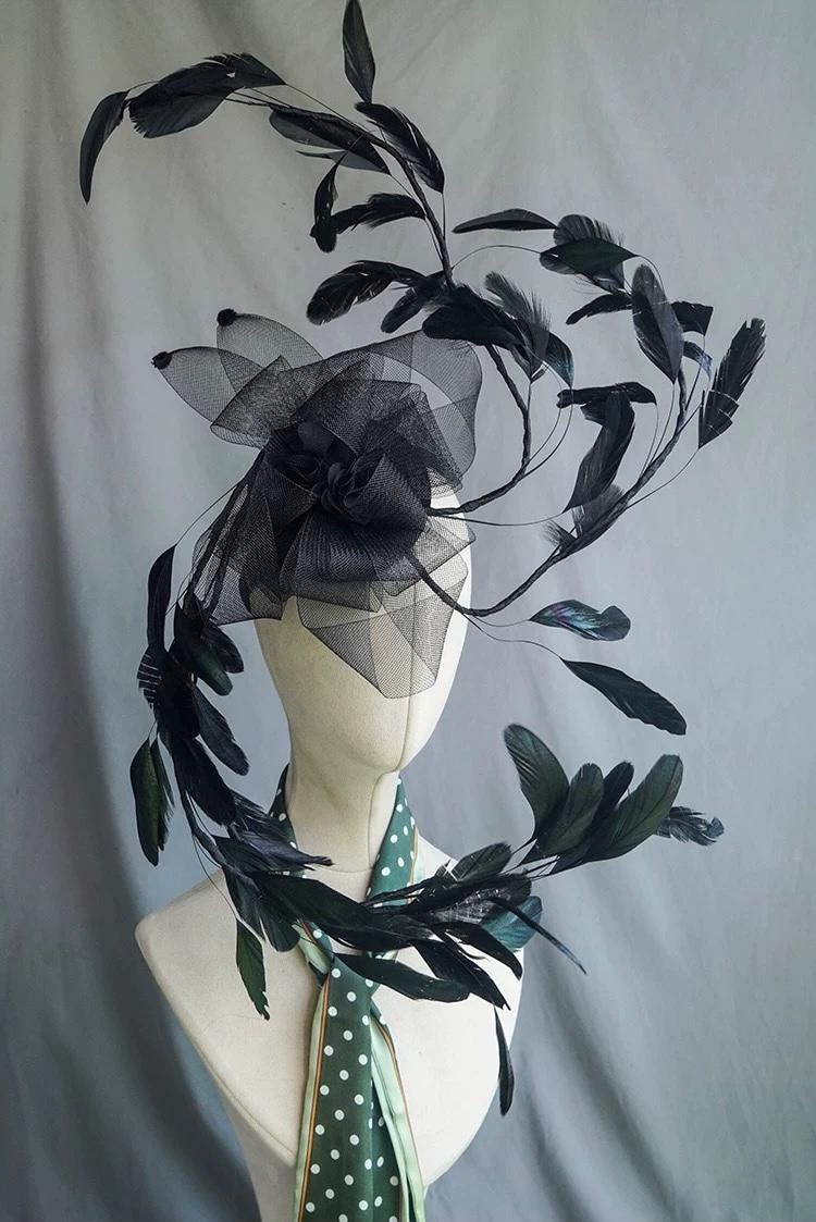 Black Feather Sculptural Gothic Fascinator displayed as wearable art