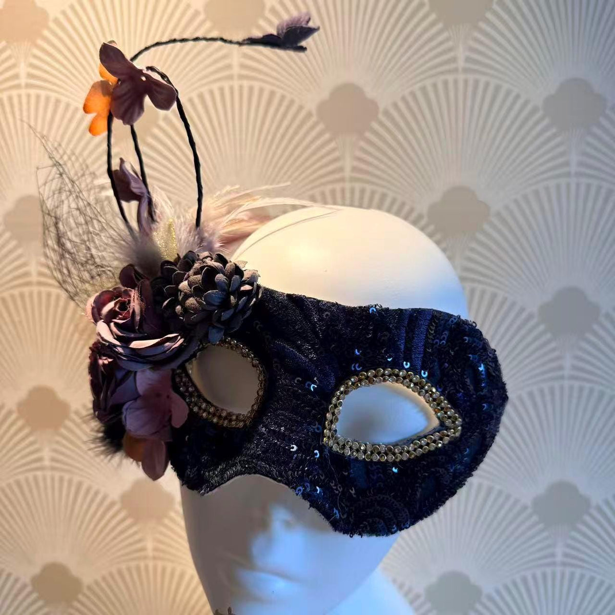 Purple Floral Feathers Masquerade Mask displayed as wearable art