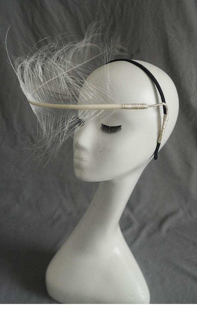 White Ostrich Feather Minimalist Avant Garde Headpiece showing its carefully made details