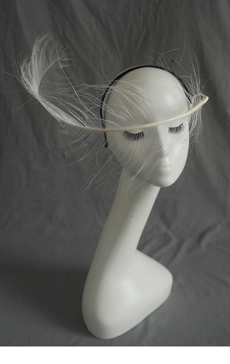 Handcrafted White Ostrich Feather Minimalist Avant Garde Headpiece with feather