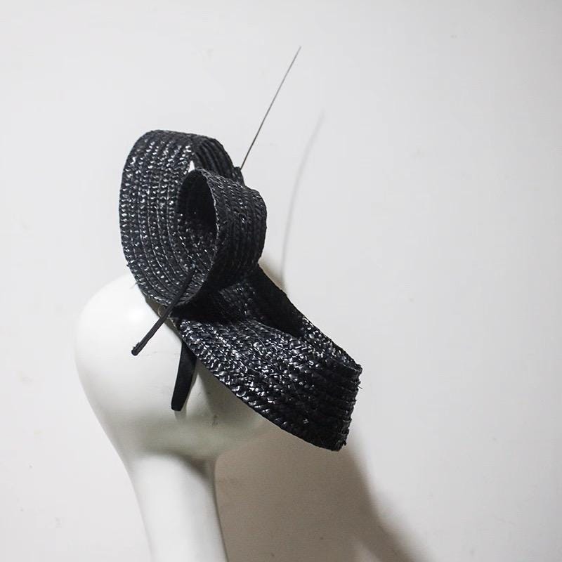 Sculptural Sinamay Cocktail Hat displayed as wearable art