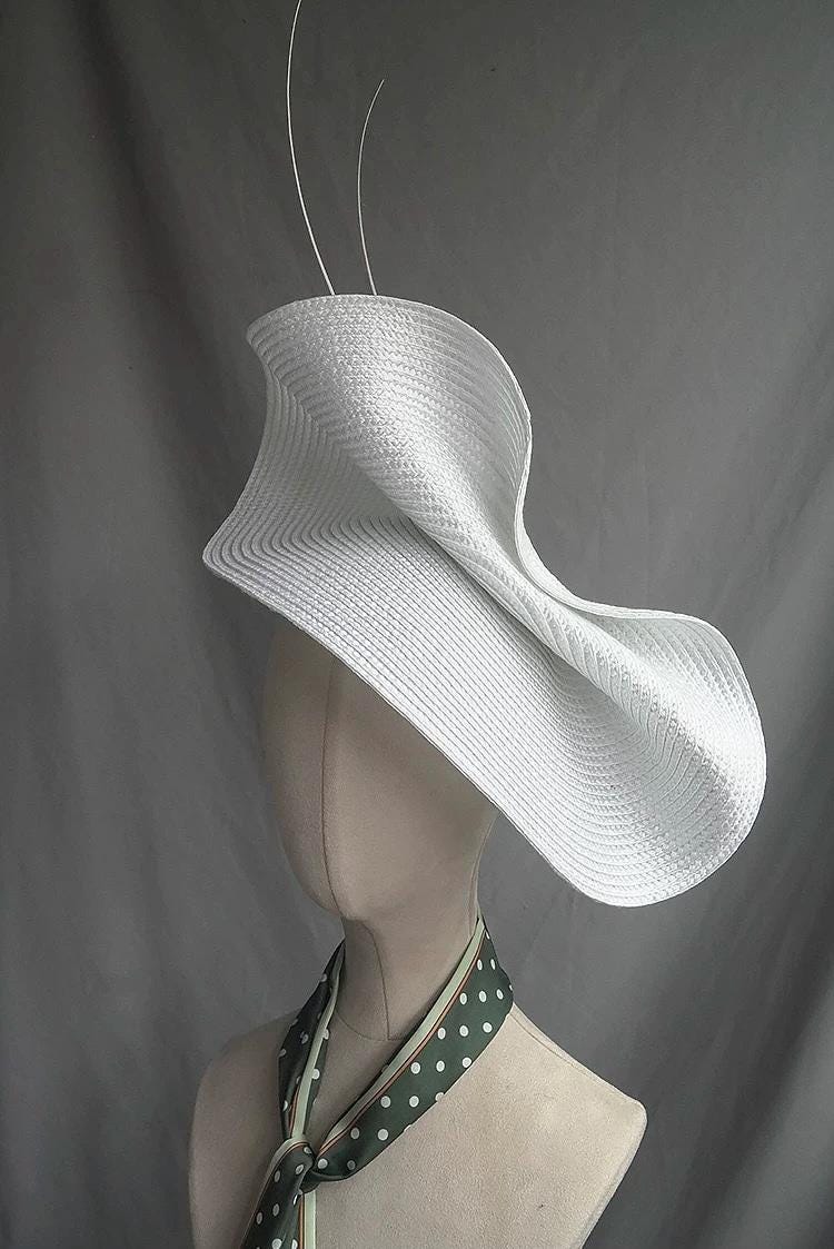 Sculptural Derby Hat displayed as wearable art