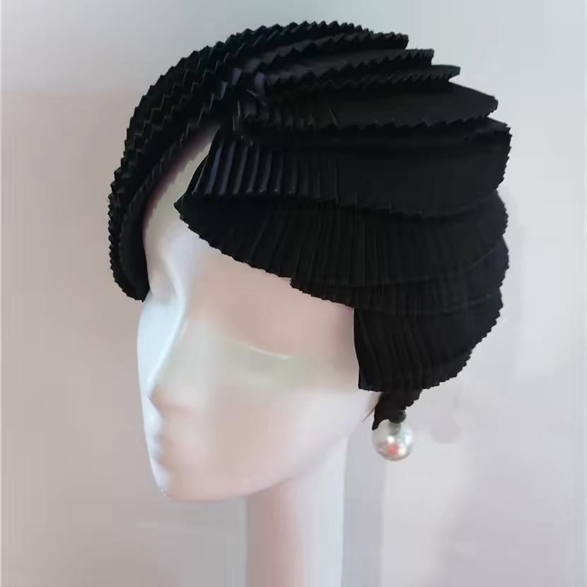 Black Avant Garde Pleated Sculptural Futuristic Headpiece displayed as wearable art