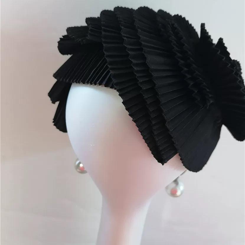 Detailed view of the handmade Black Avant Garde Pleated Sculptural Futuristic Headpiece