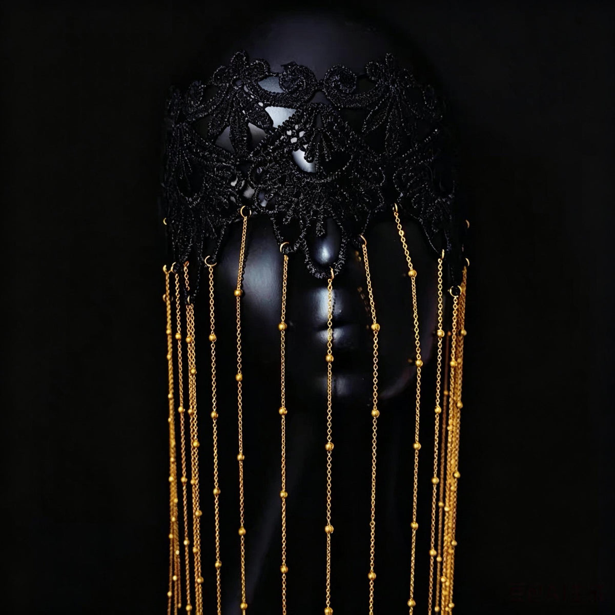 Black & Gold Lace Tassels Masquerade Mask displayed as wearable art